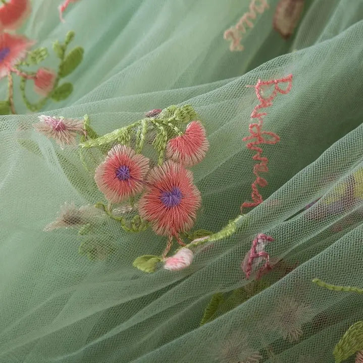 Dress covered in flower embroidery