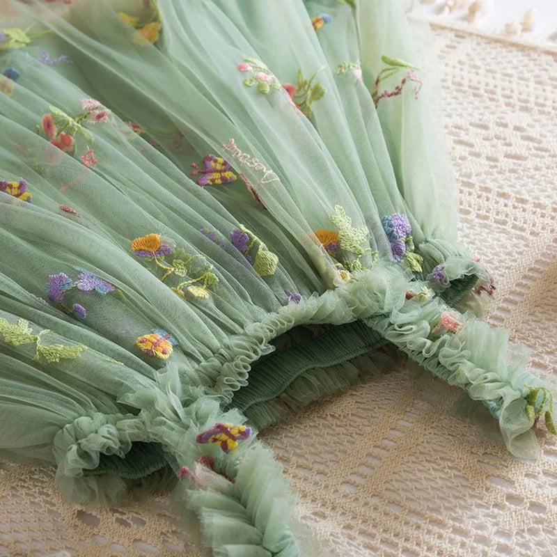 Dress covered in flower embroidery