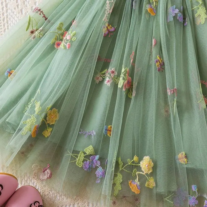 Dress covered in flower embroidery