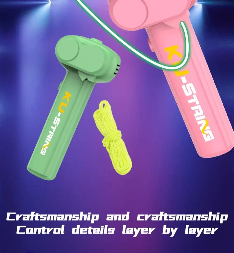 Pink and green toys with a yellow rope on a purple background